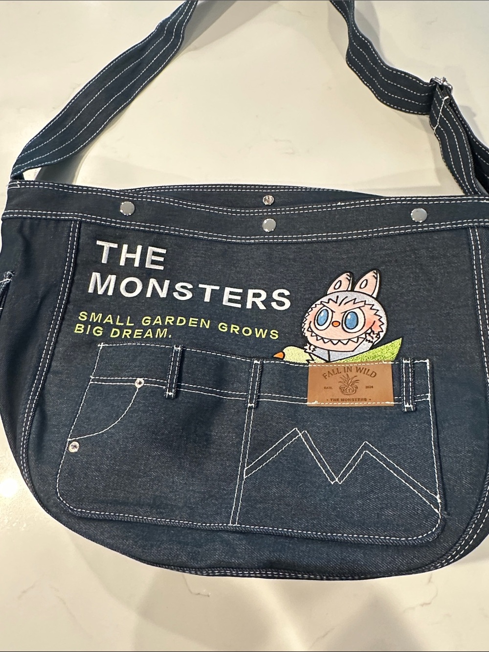 The Monsters Navy Canvas Messenger Bag by Pop Mart